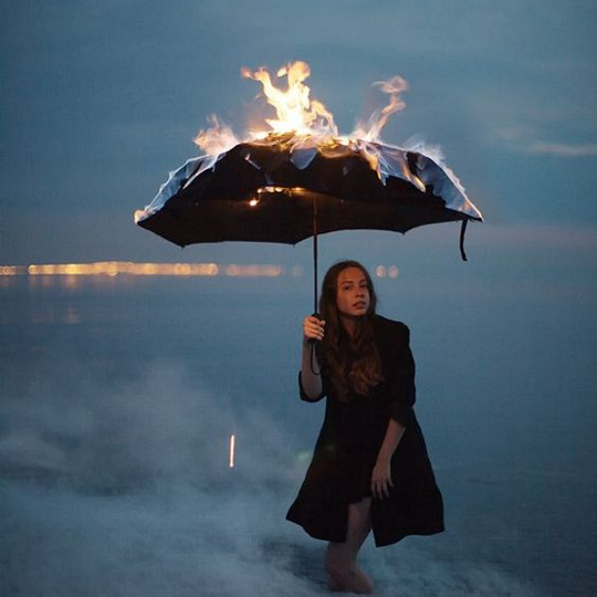 girl umbrella on fire