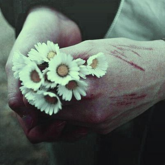 cut hands holding flowers