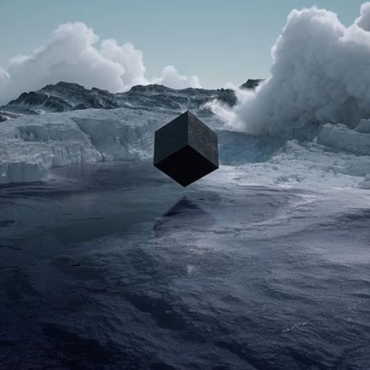 black cube in an icy landscape